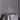 A minimalist round wedding table featuring a white candle centrepiece, set in Silver Plated Candle Holders stands.