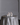 A round wedding table features nine lit Hall of Flame Pillar Package candles arranged in the centre.