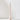 A tall, slender pale pink candle stands upright in the Hall of Flame Ballet Pink Wax Candle Holder against a plain white background with soft shadows.