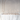 A long table set with clear glass plates, gold cutlery, and Hall of Flames Collection 2 Pre-styled Bundle (18 XXL taper candles) in glass holders creates a minimalist, elegant wedding look against a white arched wall.