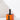 The Hall of Flame Black Plated Candle Holder, designed for XXL Tapers, rests atop an orange box with a matching black silhouette.