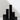 Six Hall of Flame Black Square Pillar Candles XXL in varying heights are arranged in a minimalist city skyline effect.