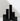Six Hall of Flame Black Square Pillar Candles XXL in varying heights are arranged in a minimalist city skyline effect.