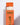 A white unscented candle from the Hall of Flame Wedding Pillar Package (42 pillar candles) is partially pulled out of an upright orange box with gold and white text, displayed on a white surface with a visible shadow.