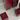Several burgundy square candles are arranged on a glossy Acrylic Candle Drip Tray by Hall of Flame, which reflects the brand name in white text.