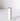 The Hall of Flame White Plated Candle Holder features a minimalist cylindrical design, standing vertically on a flat round base, perfect for XXL tapers. It casts a soft shadow against a simple white background.