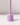 The Hall of Flame Wisteria Purple Wax Candle Holder stands upright on a white surface, its minimalist design casting a shadow to the right against an uncluttered, light background.