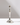 A vintage look Antique Silver Holder, a polished silver candlestick with a slender stem and decorative edges.