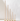 Eight cream-colored XXL Taper Candles from Hall of Flame’s Collection 6 Pre-styled Bundle are displayed in gold holders, arranged from tallest to shortest on a light background—ideal for wedding table styling.