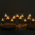 The Hall of Flame Floating Tealight Wedding Bundle features elegant glass vessels with floating tealights, creating a warm, cozy ambiance—perfect as a wedding table centerpiece.