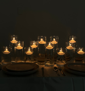 The Hall of Flame Floating Tealight Wedding Bundle features elegant glass vessels with floating tealights, creating a warm, cozy ambiance—perfect as a wedding table centerpiece.
