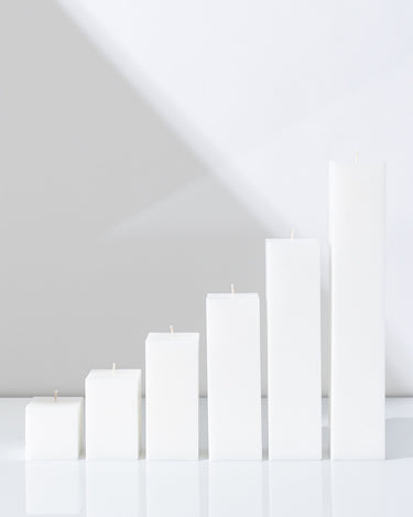 Six White Square Pillar Candles XXL by Hall of Flame in various sizes. 
