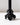 A close-up of the Hall of Flame SAMPLE | Black Flower Holder, a glossy, sculpted candle holder shaped like ruffled leaves, 3D printed in black and displayed against a plain white background.