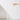 Four Hall of Flame White | Realistic LED Flameless Taper Candles of different heights stand on a white surface. A hand enters from the right to touch the tallest candle’s lifelike flame.