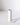 The Hall of Flame White Plated Candle Holder features a minimalist cylindrical design, standing vertically on a flat round base, perfect for XXL tapers. It casts a soft shadow against a simple white background.
