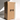 A tall white candle stands next to a large Hall of Flame box labeled “Bulk Candles | Wholesale by-the-box – 60 PC XXL” with “THIS WAY UP” arrows, ideal for wholesale candles Australia. Light from the left casts shadows.