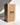 A tall white candle stands upright beside a large Hall of Flame box labeled Bulk Candles | Wholesale by-the-box, featuring three arches and the words THIS WAY UP—ideal for anyone seeking bulk or wholesale candles in Australia.