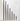 Hall of Flame’s Collection 1 | Pre-styled Bundle features 18 black taper candles of varying heights in gold holders, elegantly arranged for wedding displays against a white backdrop.